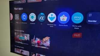 TCL Google TV on wall showing apps on home screen