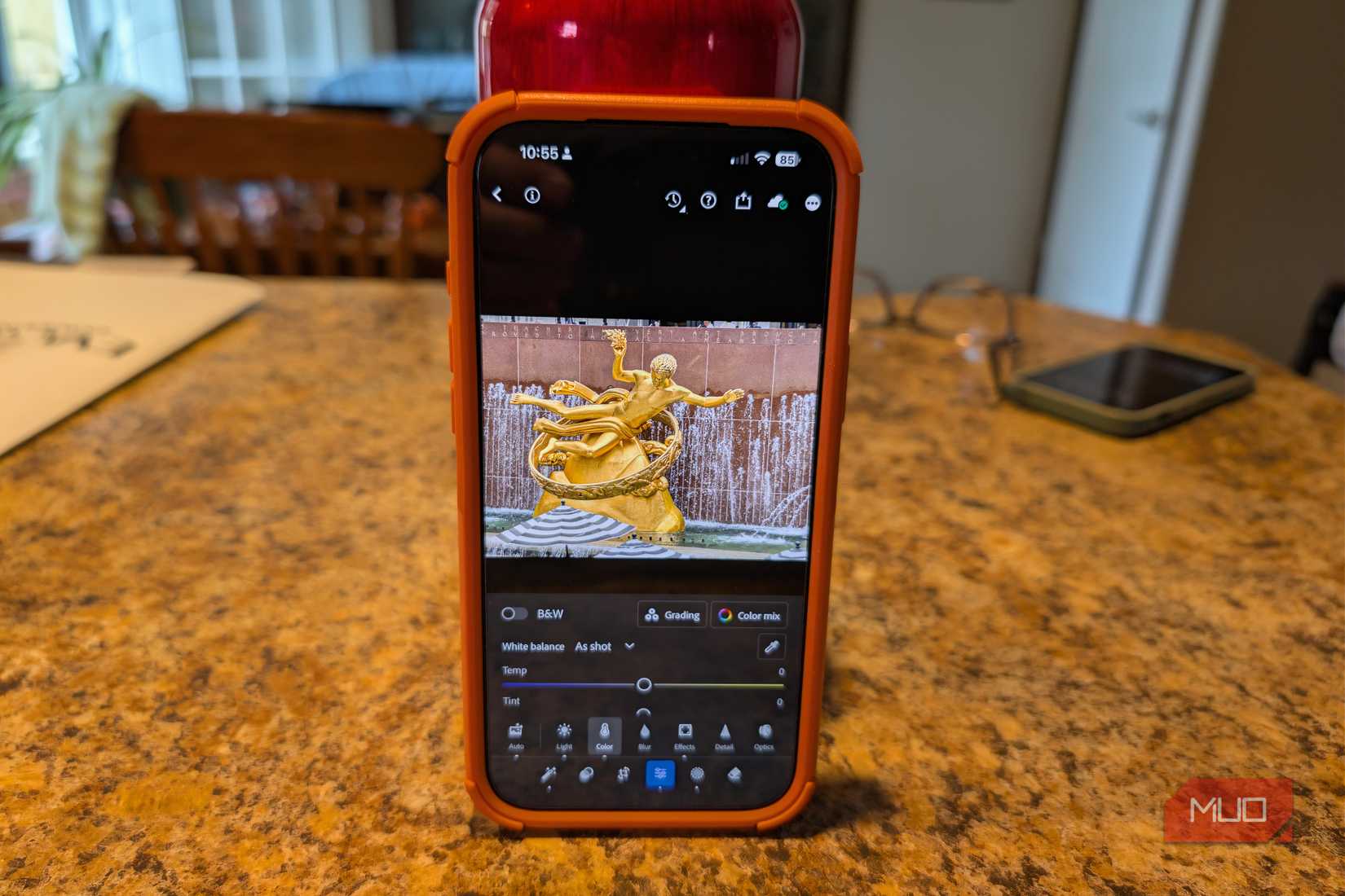 Adobe Lightroom Mobile shown on an iPhone 17 Pro Max in a kitchen.
