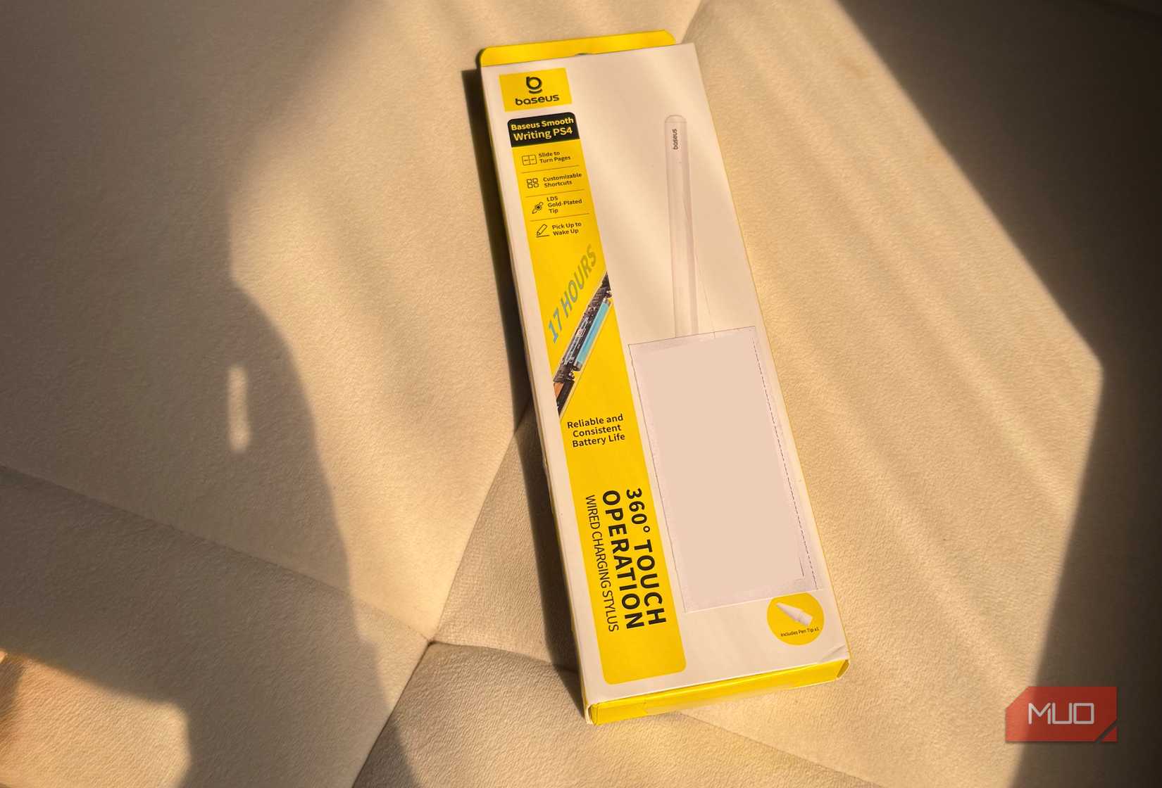 Baseus Smooth Writing PS4 box kept on sofa
