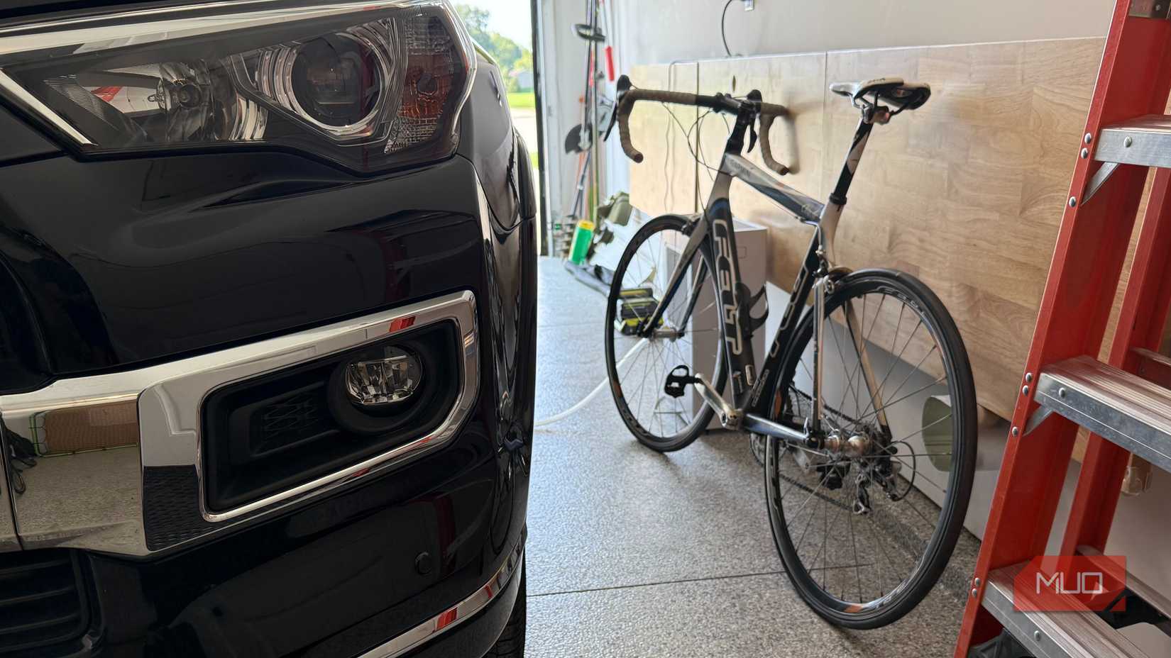 bike next to black car in garage