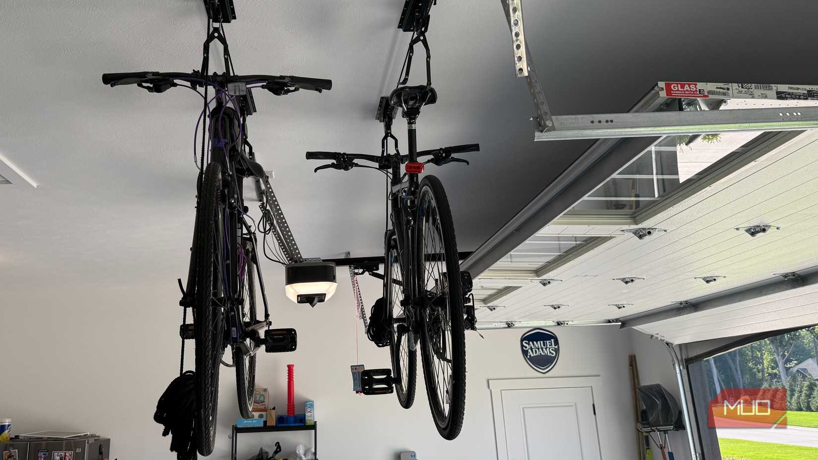 bikes hanging from ceiling with overhead door open