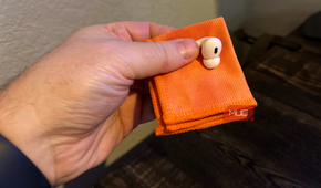cleaning airpods with a soft lint-free cloth.