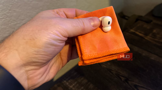 cleaning airpods with a soft lint-free cloth.