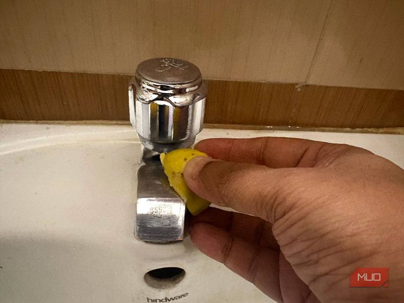 Cleaning limescale with a lemon.