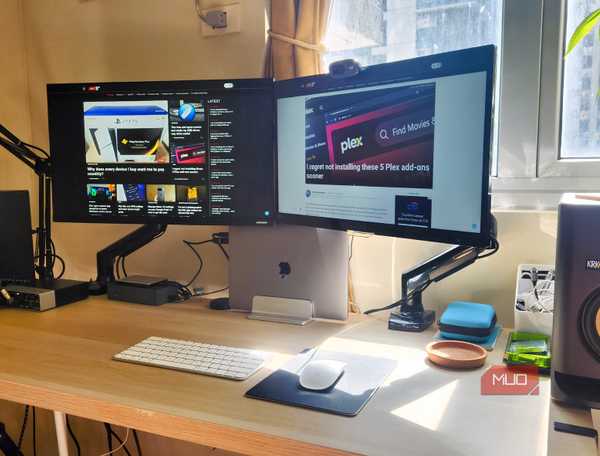 A desktop featuring dual monitors and wireless peripherals.
