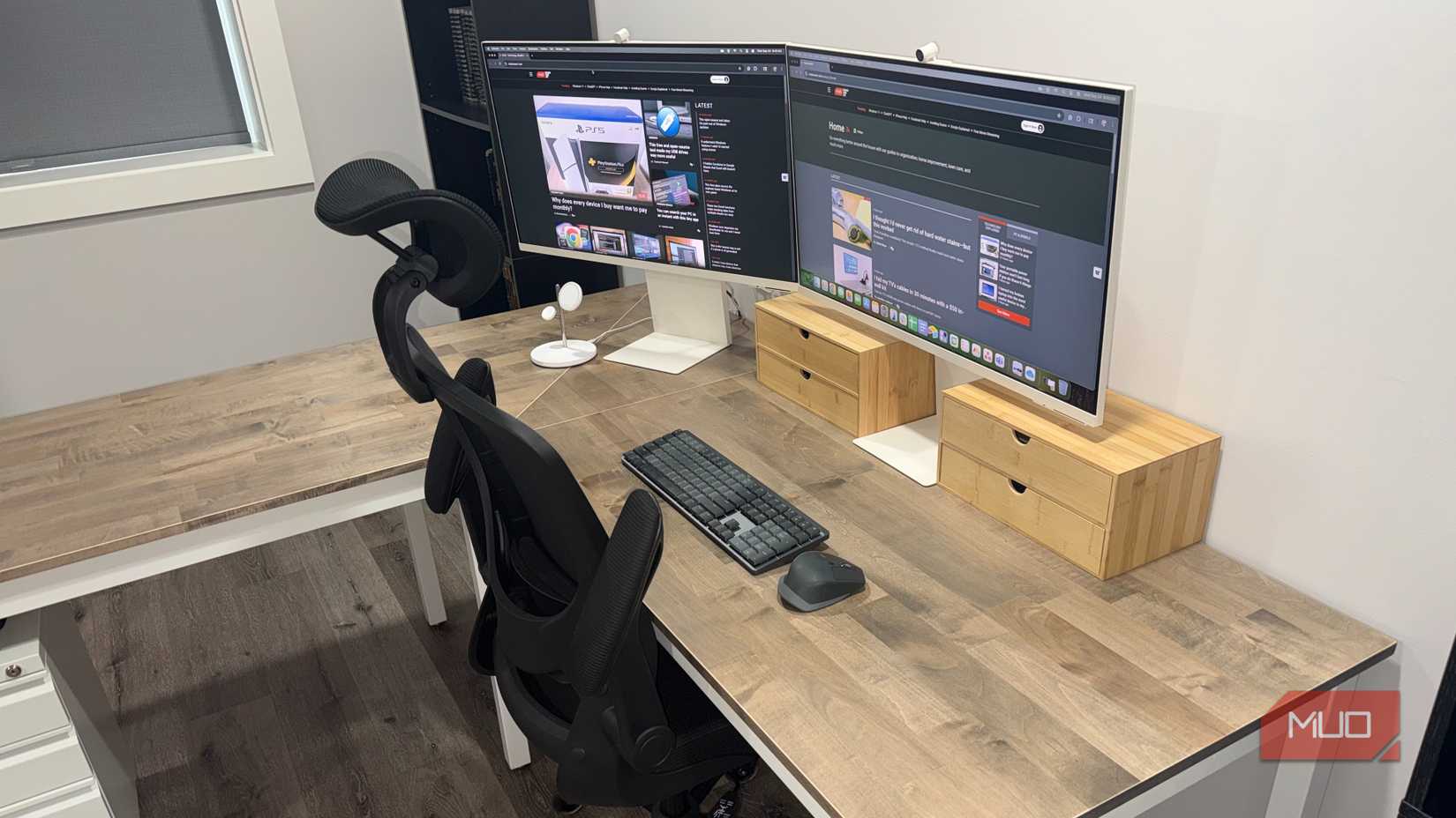 desk with 2 white samsung monitors keyboard and mouse