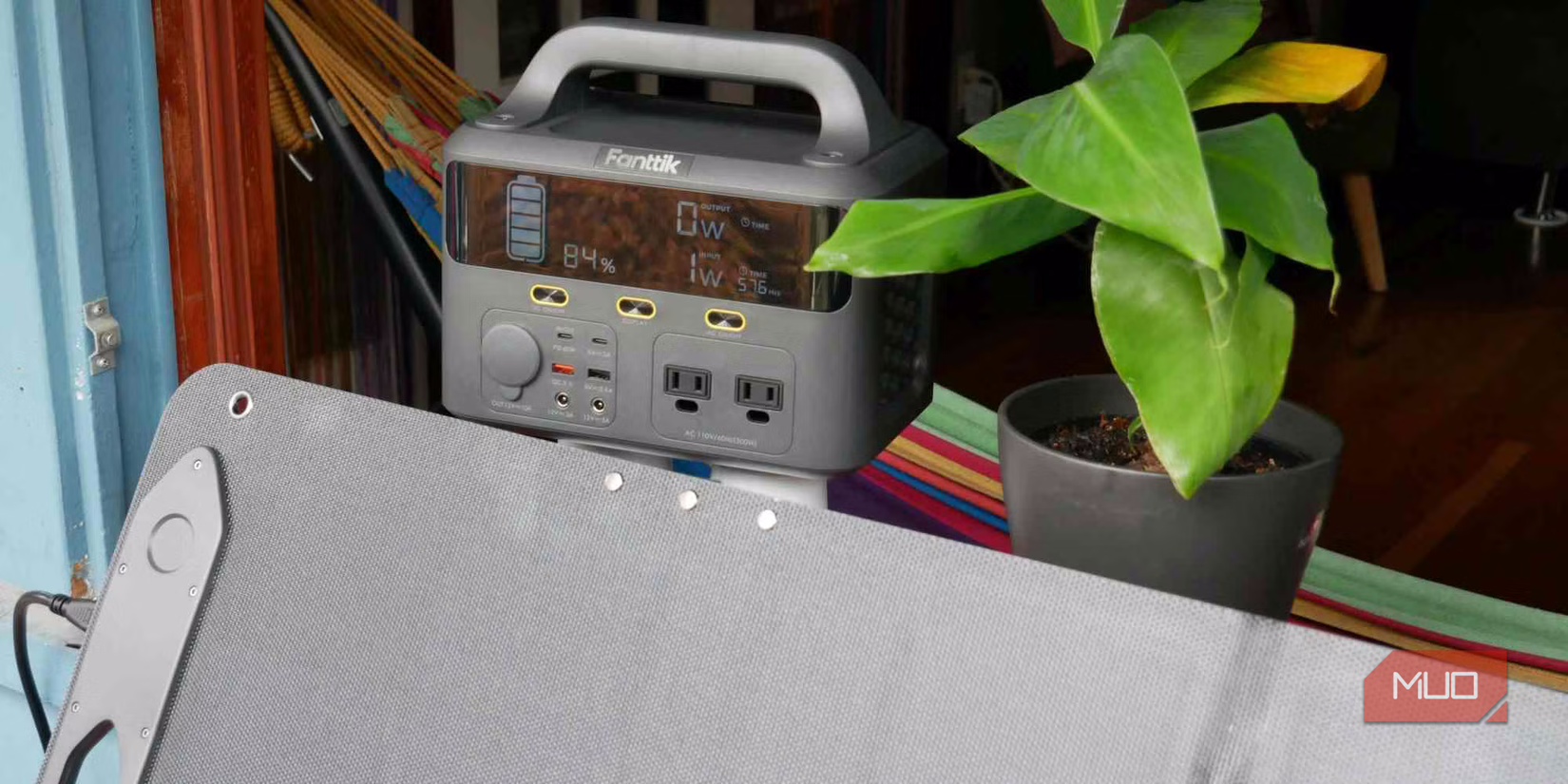 Fanttik EVO 300 power station and solar panel on window sill close up