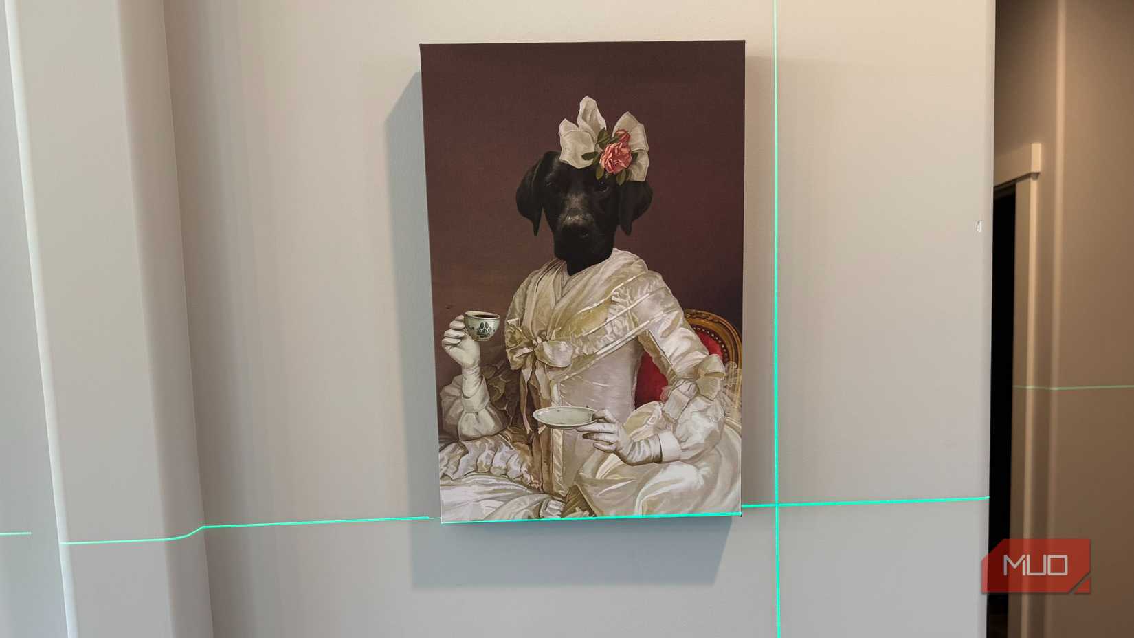 green laser level pointed at painting of dog human