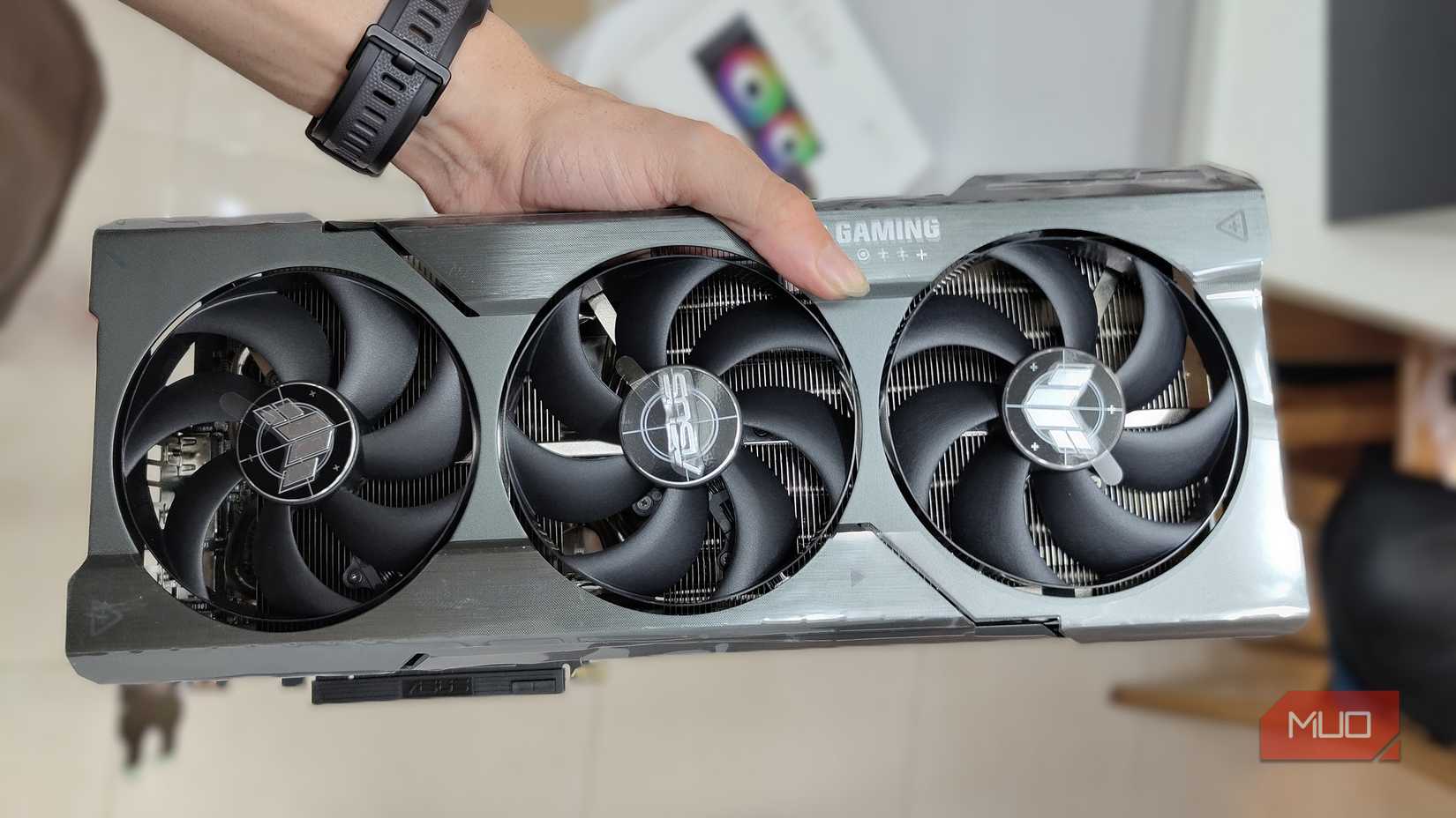 Hand holding an AMD graphics card