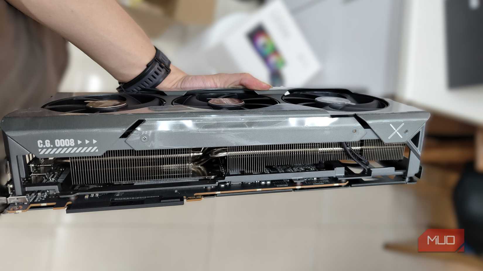 Hand holding an AMD Radeon RX7900 XT
