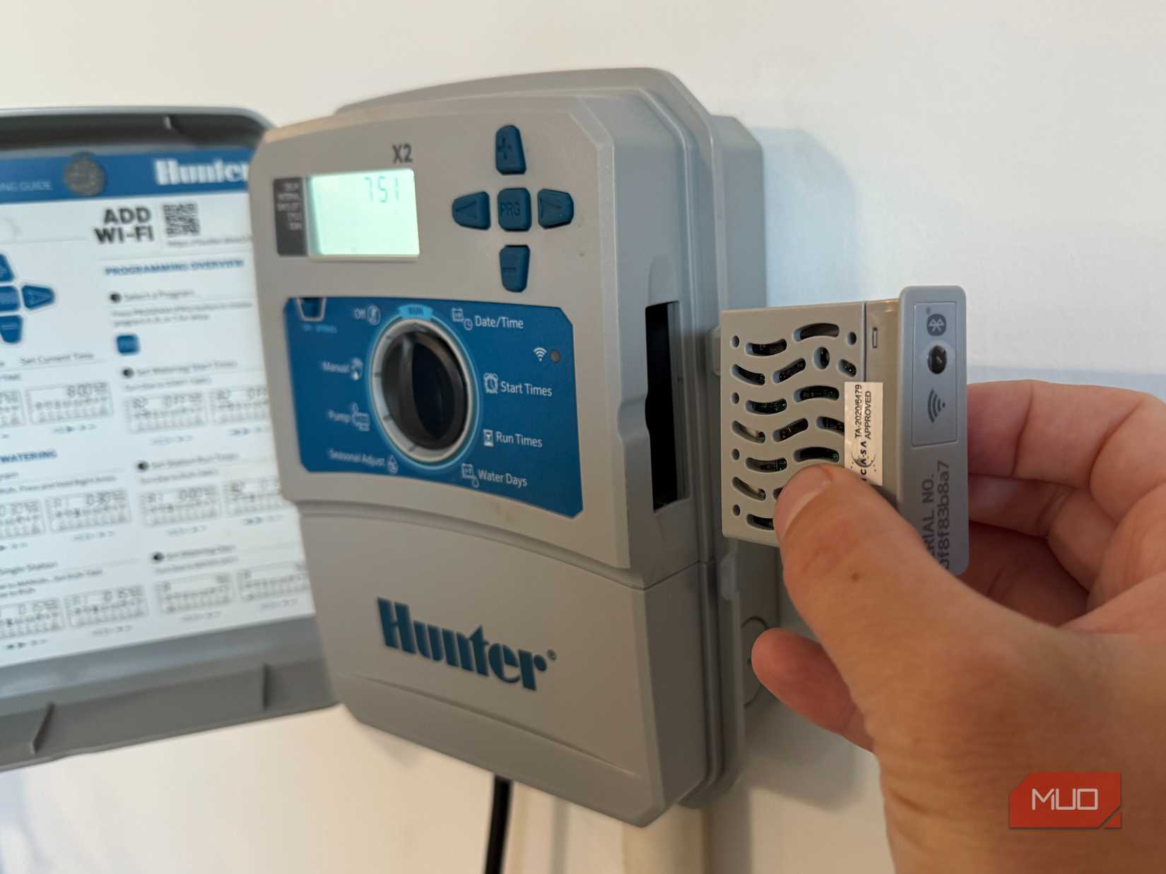 hunter hydrawise with door open and inserting wi-fi controller