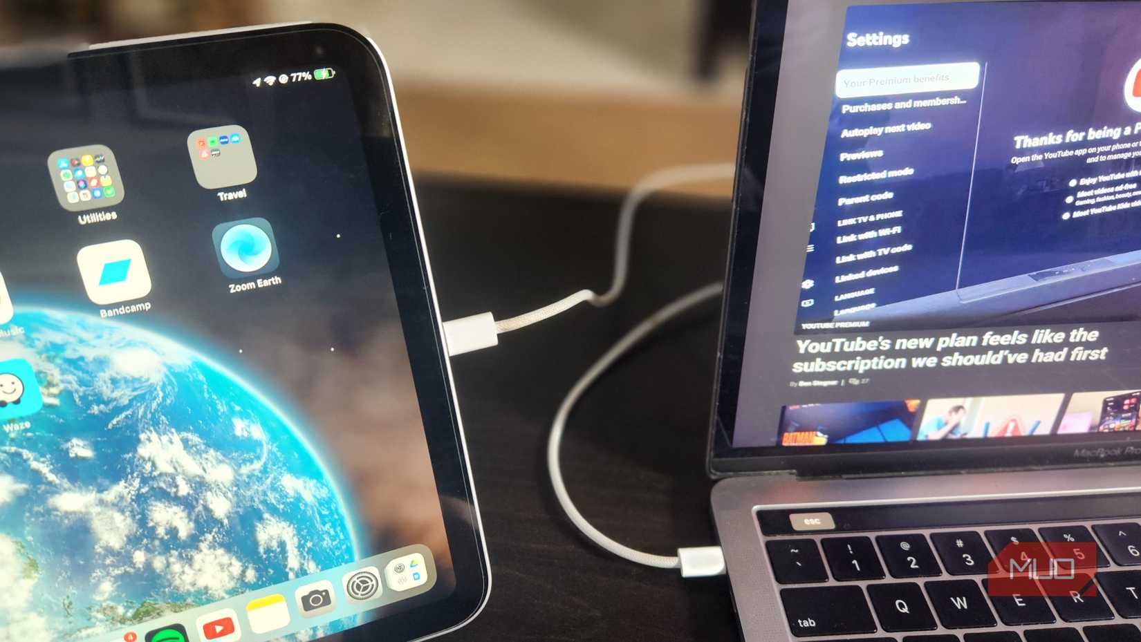 An iPad and Mac with a wired connection.