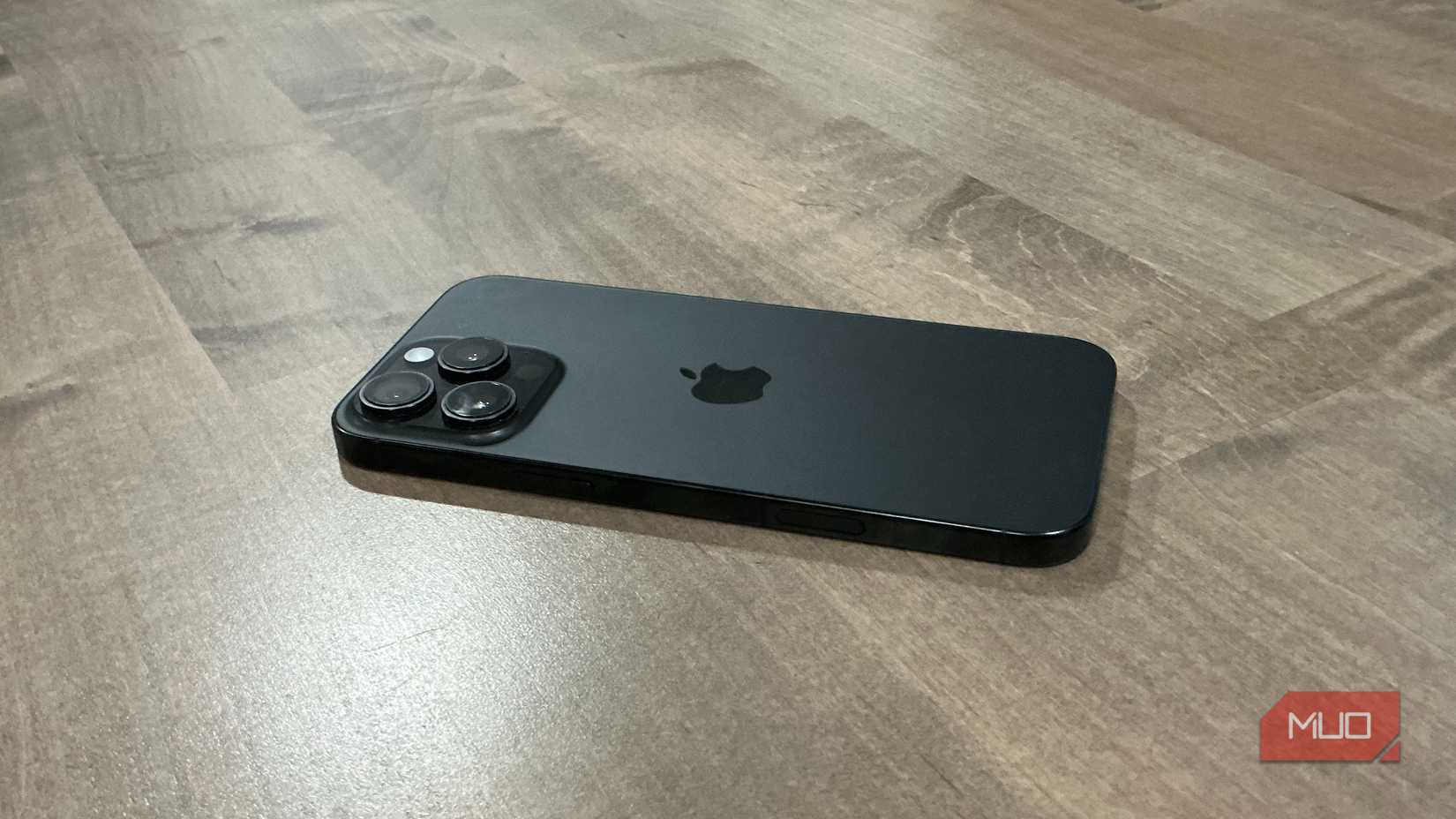 iphone pro max 16 back on wooden desk