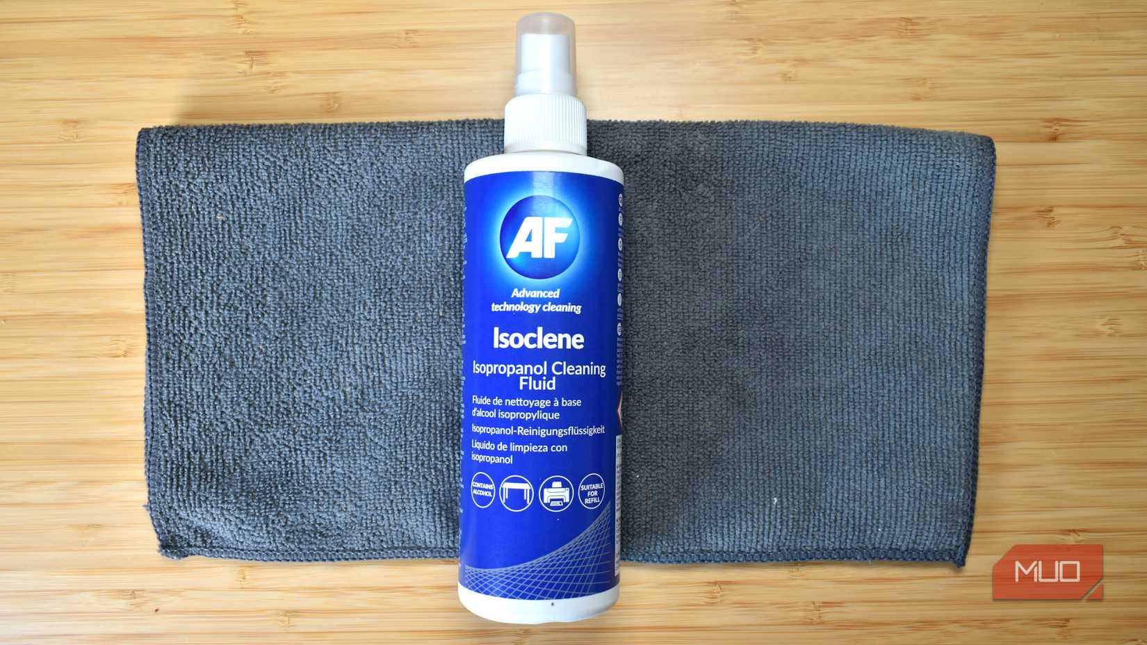 isopropyl alcohol cleaning fluid top down view with micro fiber cloth.