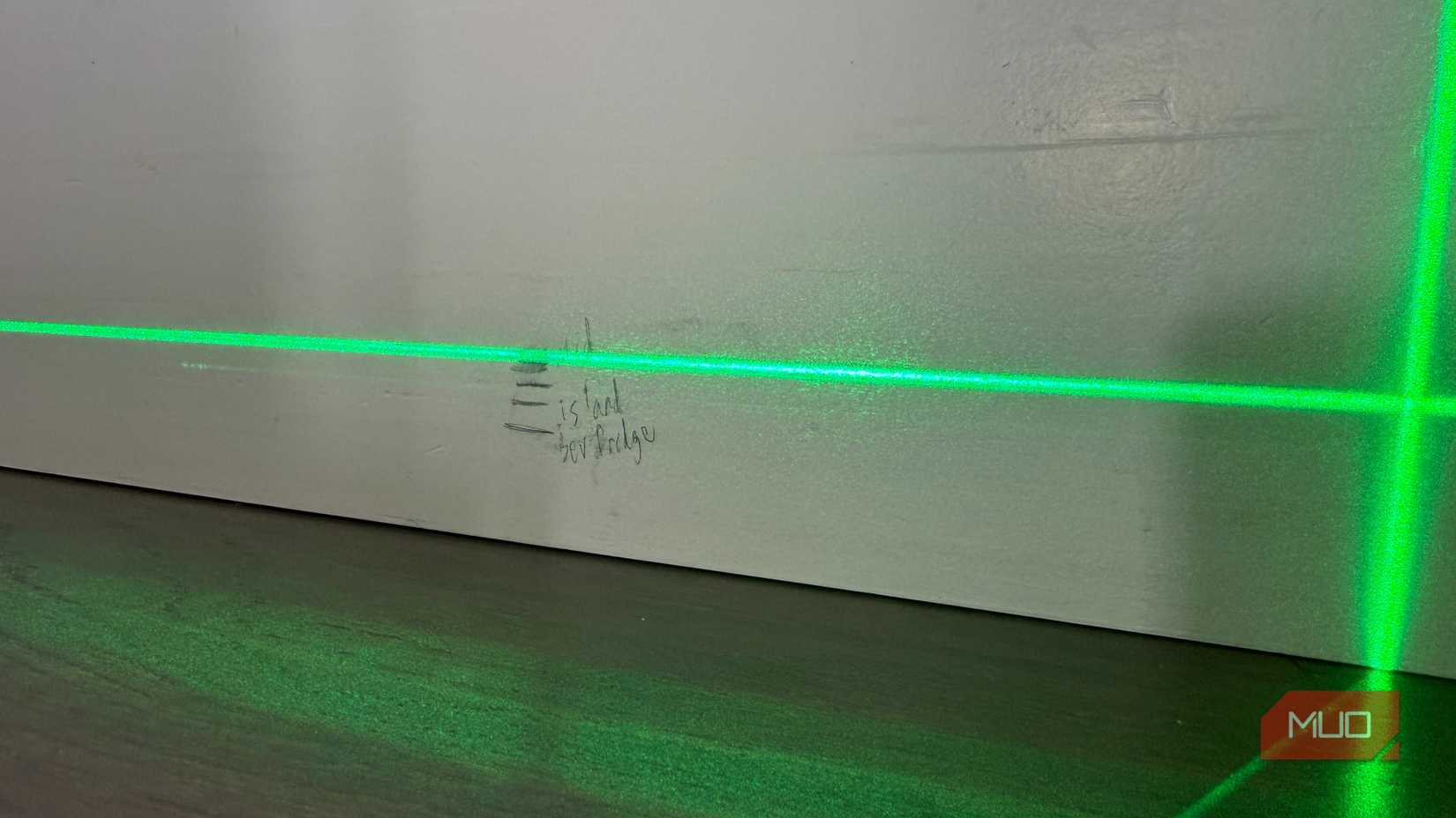 laser level with markings on wall showing floor height variations