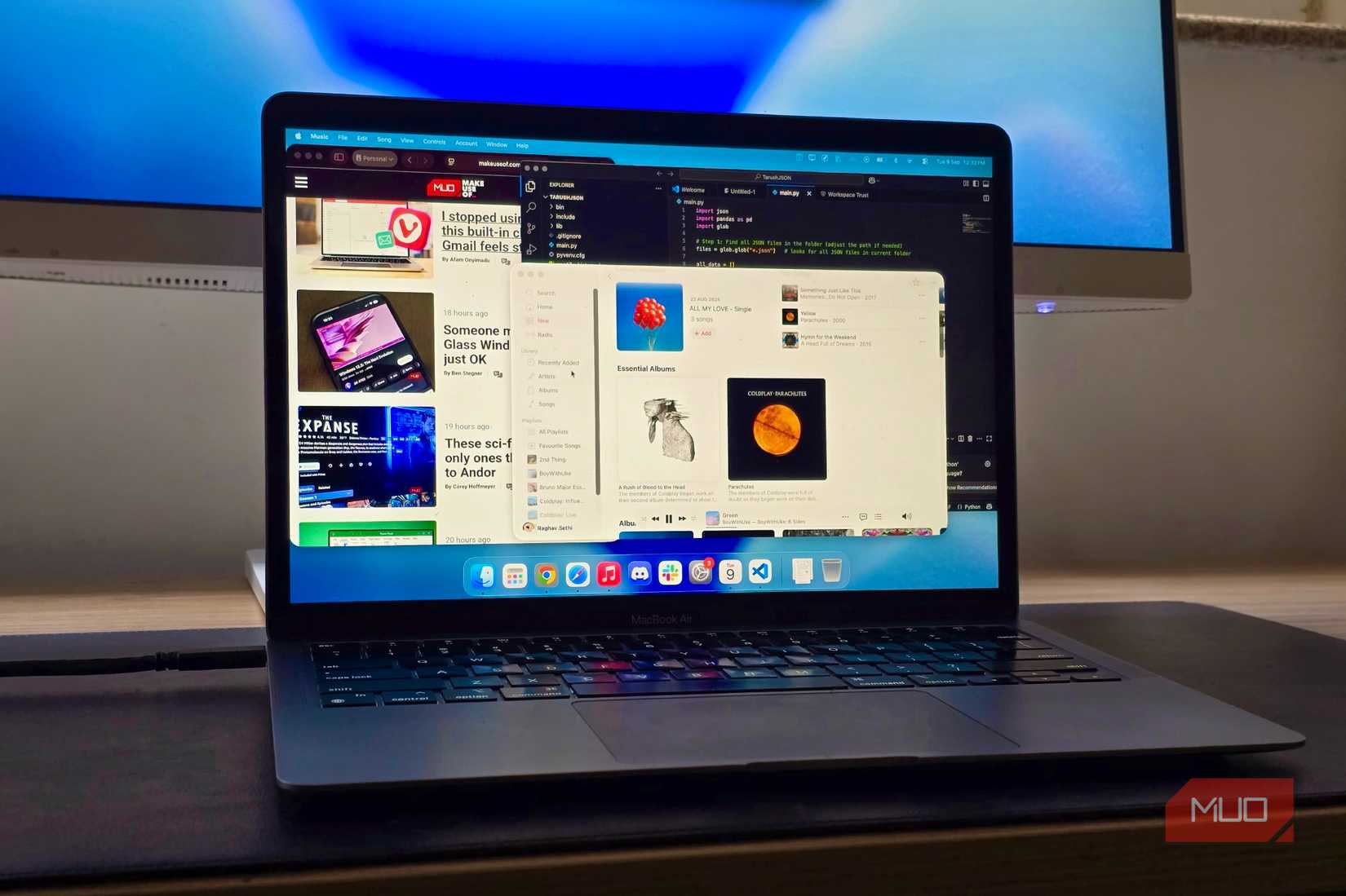 MacBook Air connected to a monitor with multiple windows open