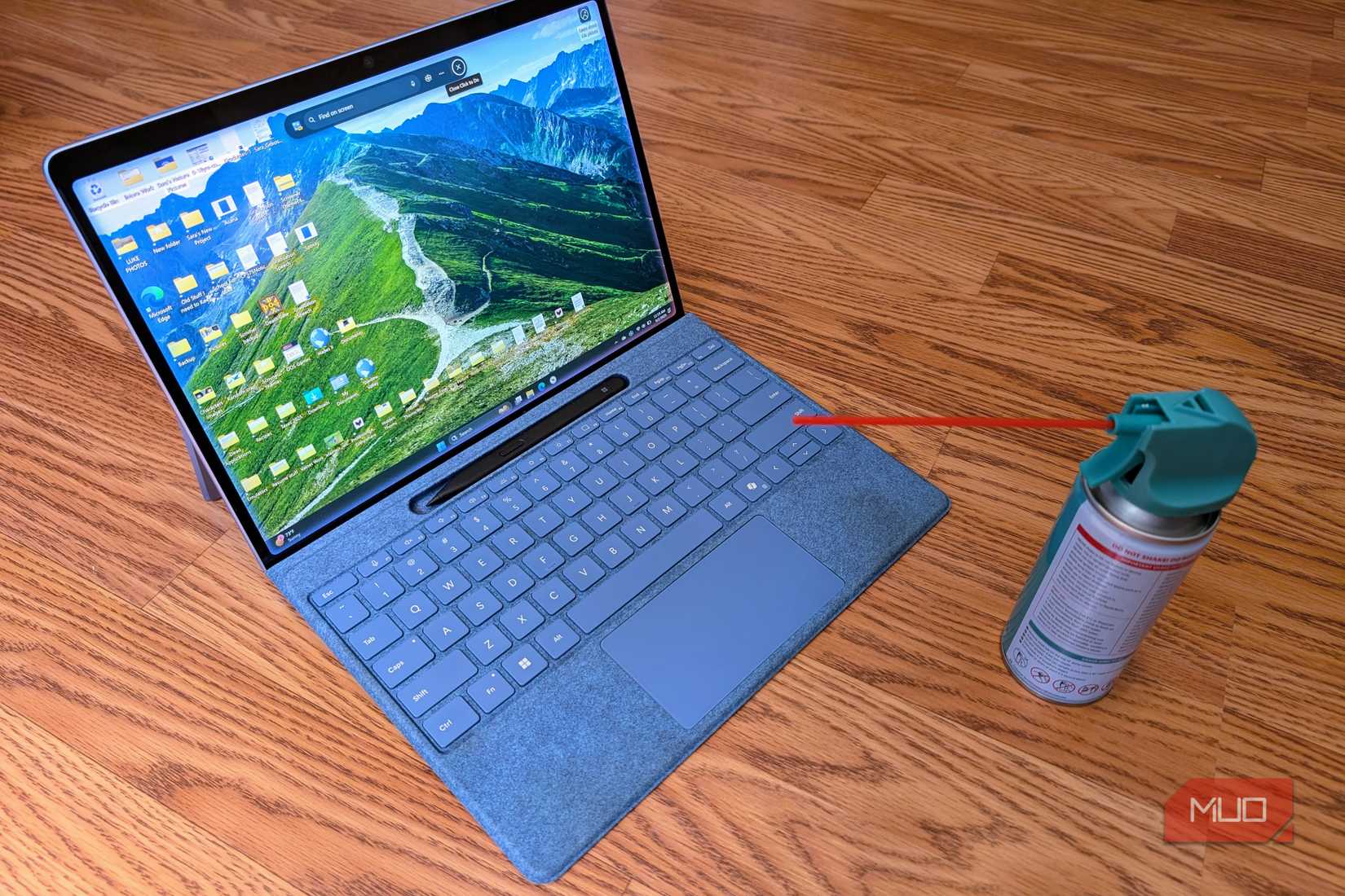 Microsoft Surface Pro with can of compressed air