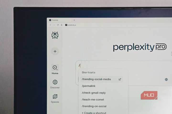 Perplexity Comet browser open on a BENQ monitor