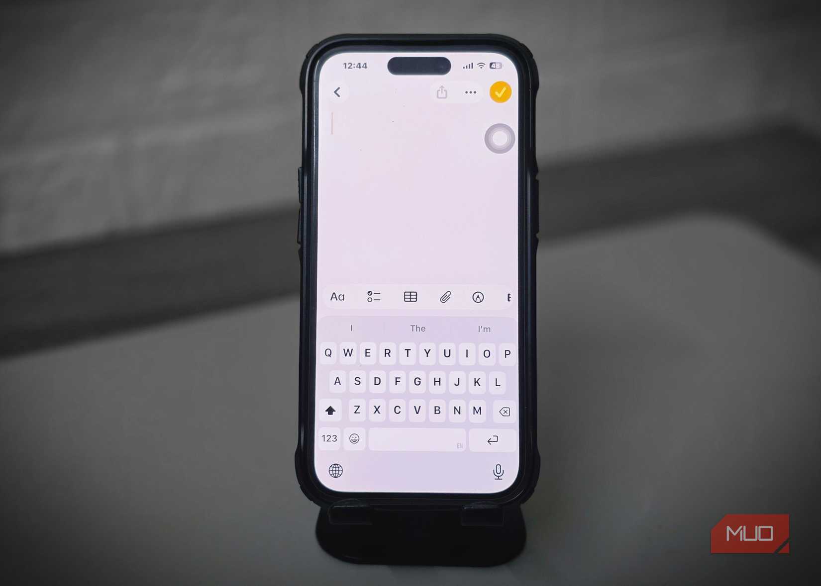 Phone with Notes app open and keyboard covering half the screen