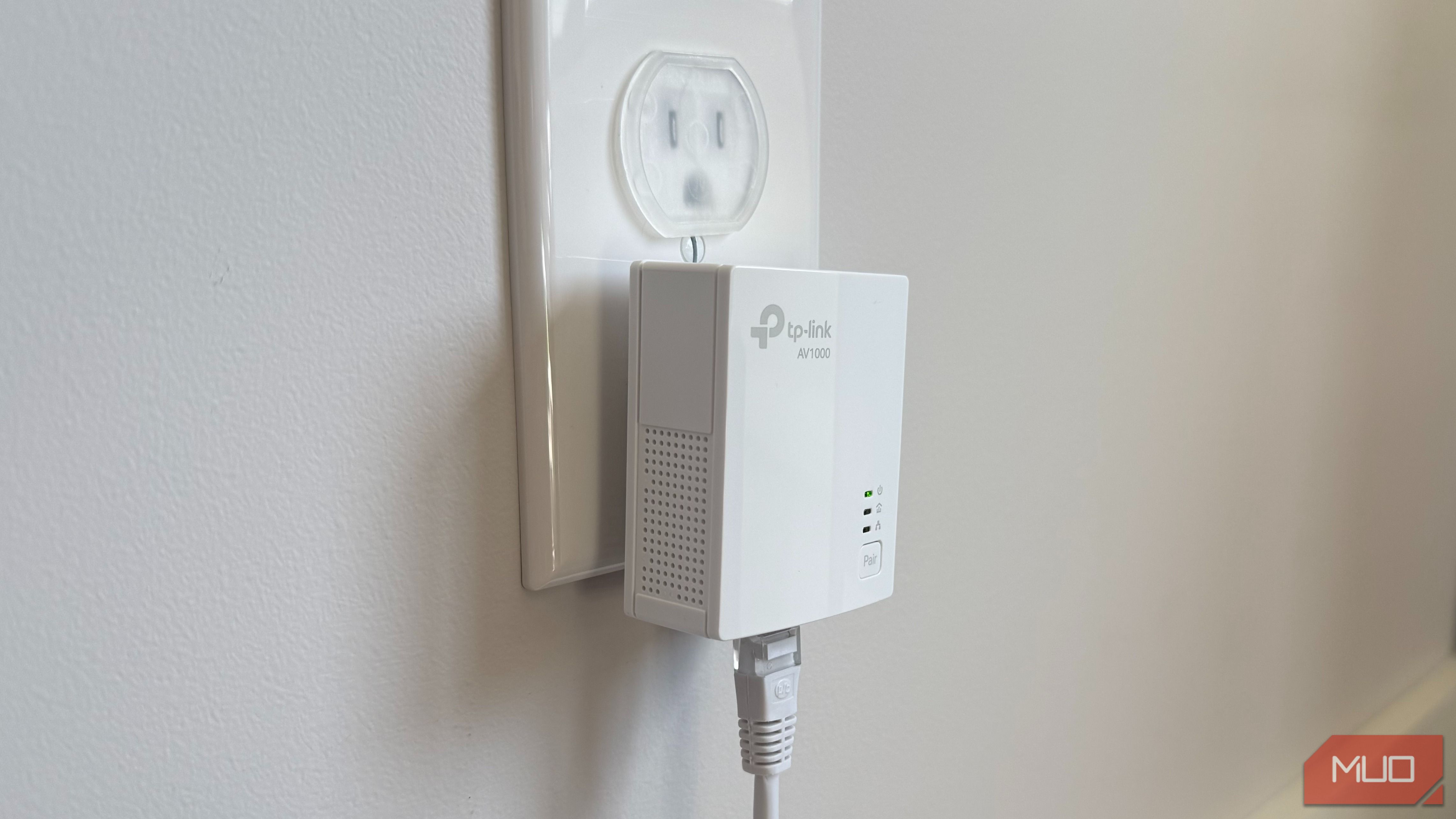 powerline adapter in bedroom plugged into wall socket