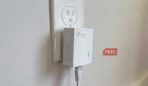powerline adapter in bedroom plugged into wall socket