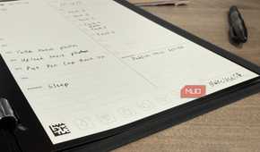 Rocketbook pro open on desk with erasable pen