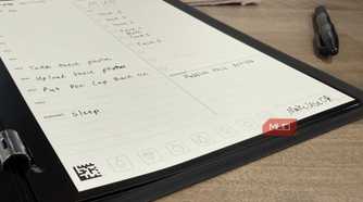 Rocketbook pro open on desk with erasable pen
