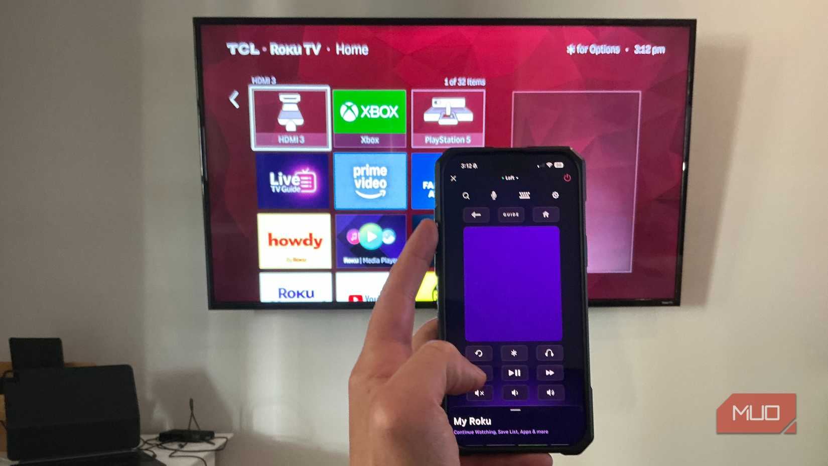 Roku App on iPhone 16 Pro Max controlling TCL Roku TV in background