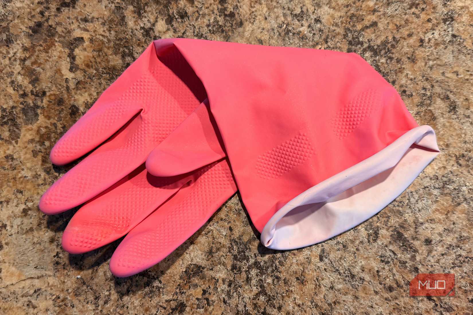 A pick rubber glove in a home. 