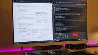 Samsung DeX running 2 Chrome windows with a keyboard and mouse on a table.