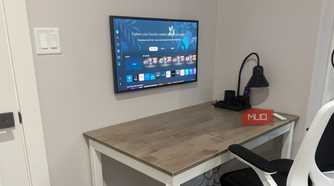 samsung frame wall mounted with cables hidden as monitor