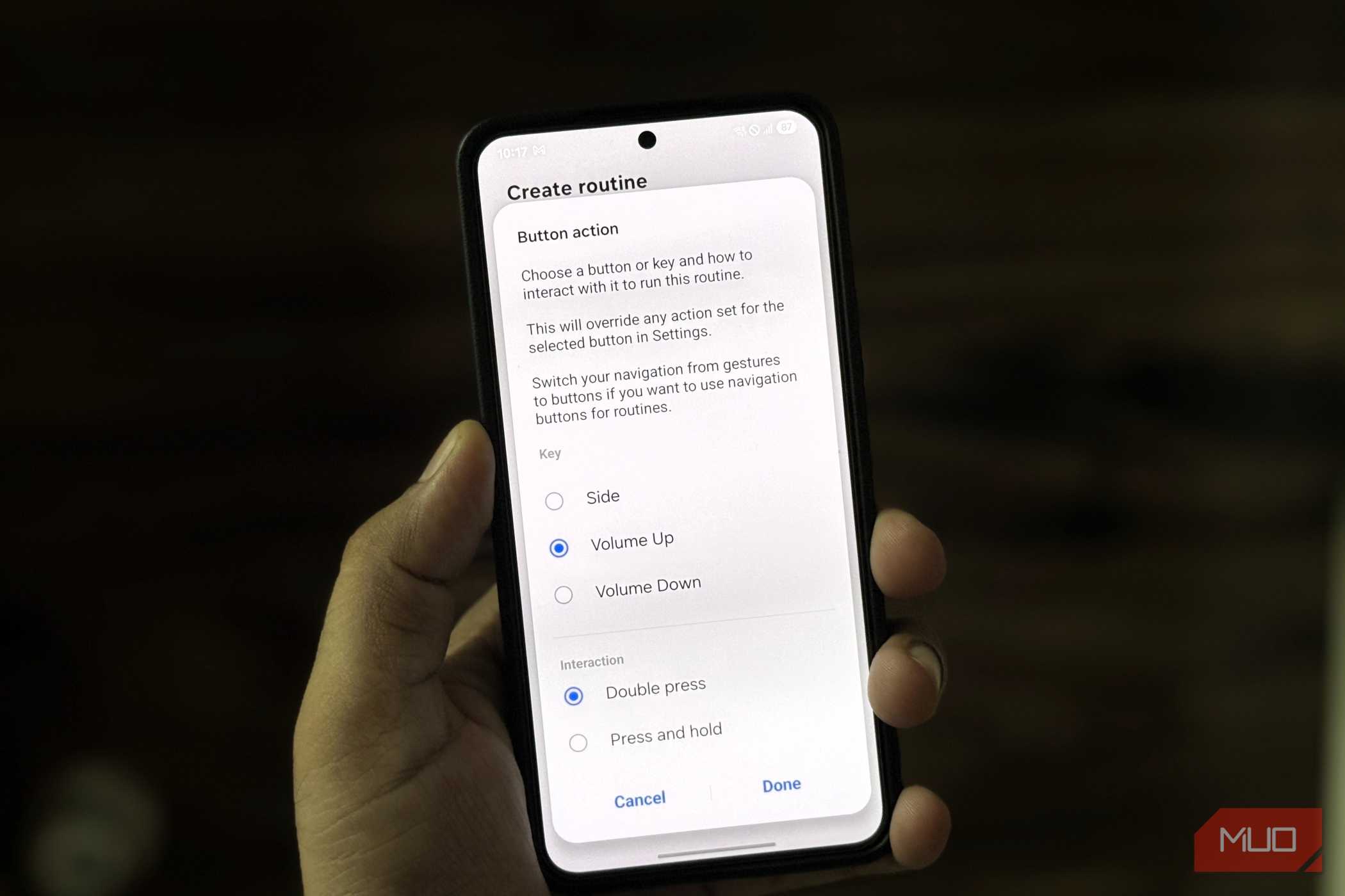 Samsung phone in hand showing button action menu