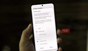 Samsung phone in hand showing button action menu
