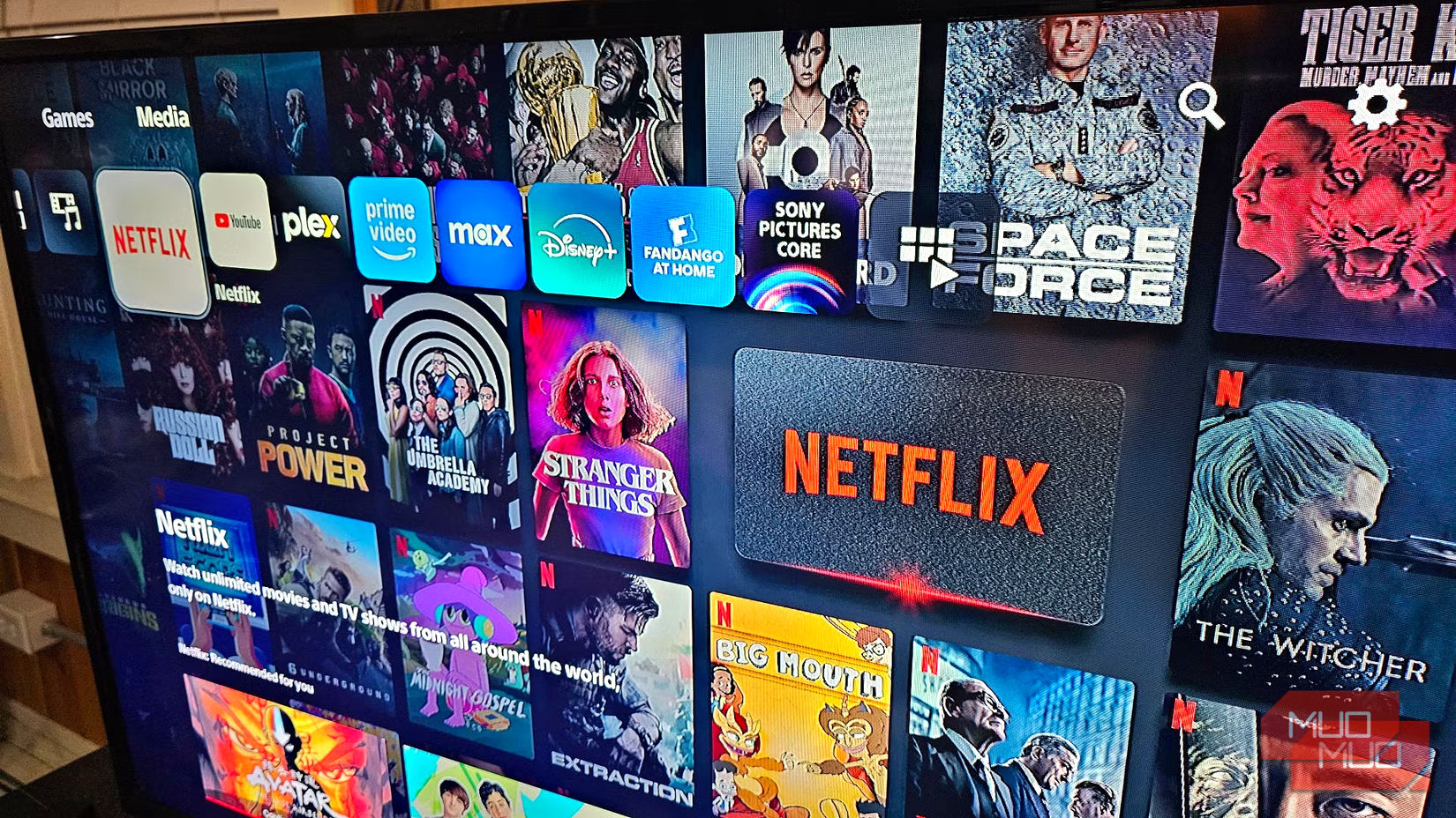 smart tv with netflix youtube plex streaming platform options and film titles visible on tv screen