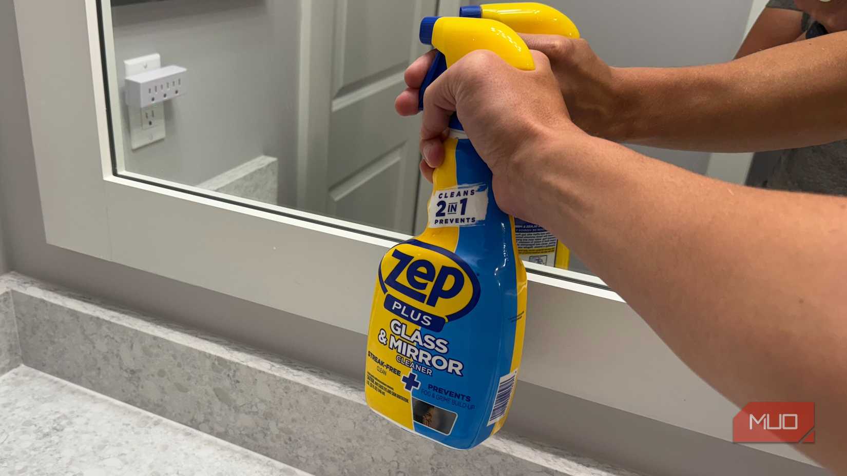 spraying Zep onto mirror