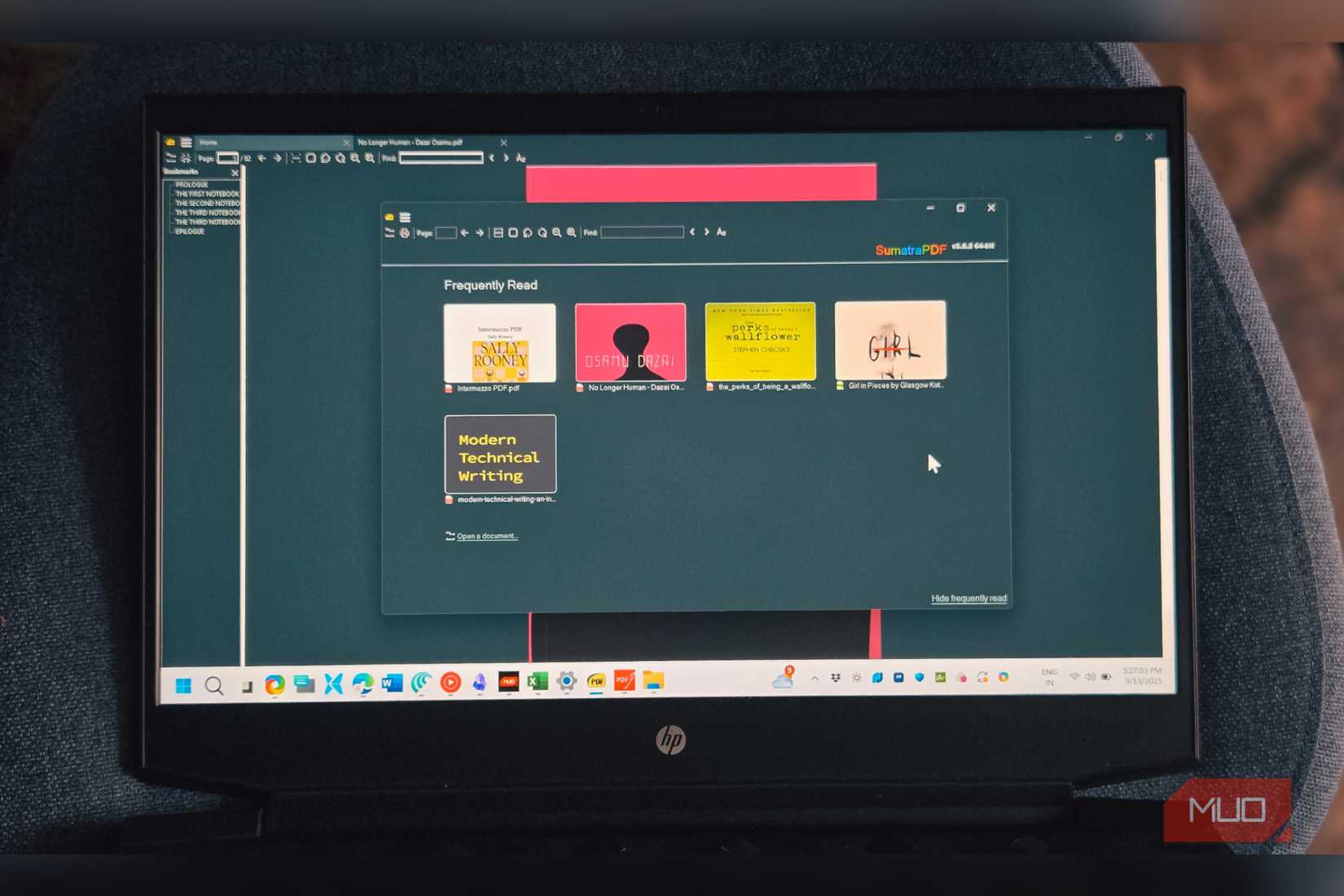 Sumatra PDF app open on a  HP laptop that's screen down on a chair
