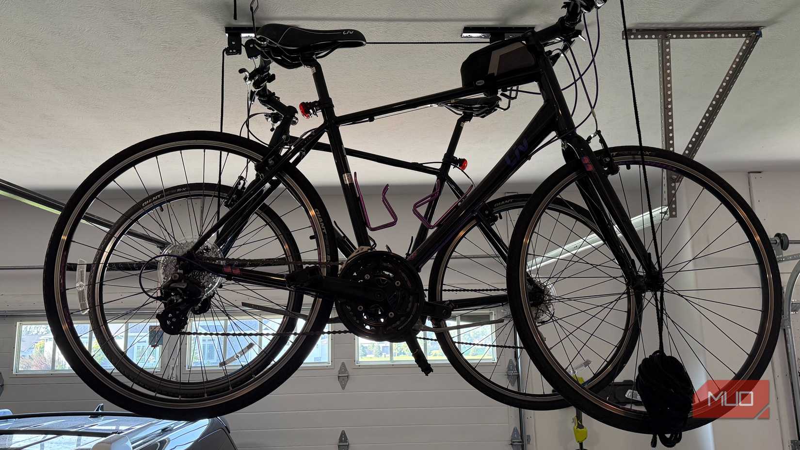 two bikes suspending from garage ceiling