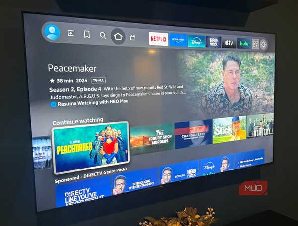 wall mounted 75 inch fire tv showing Peacemaker