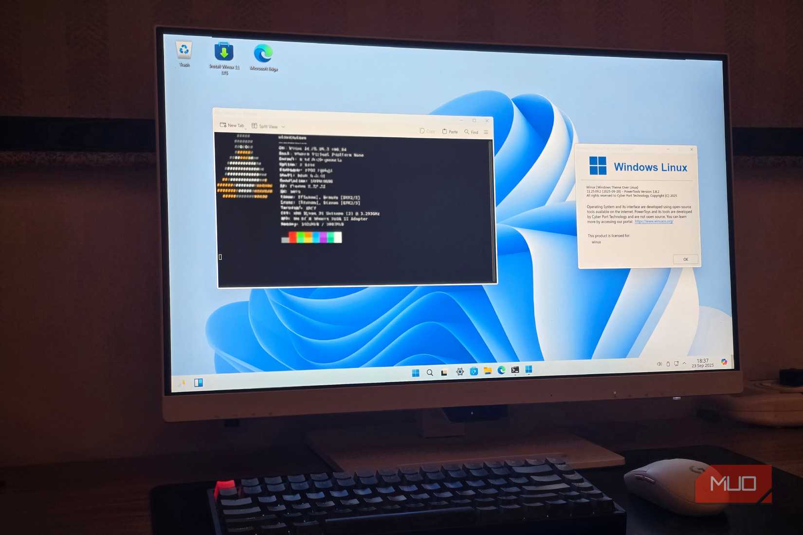 Winux running on a computer with a keyboard and mouse on the table