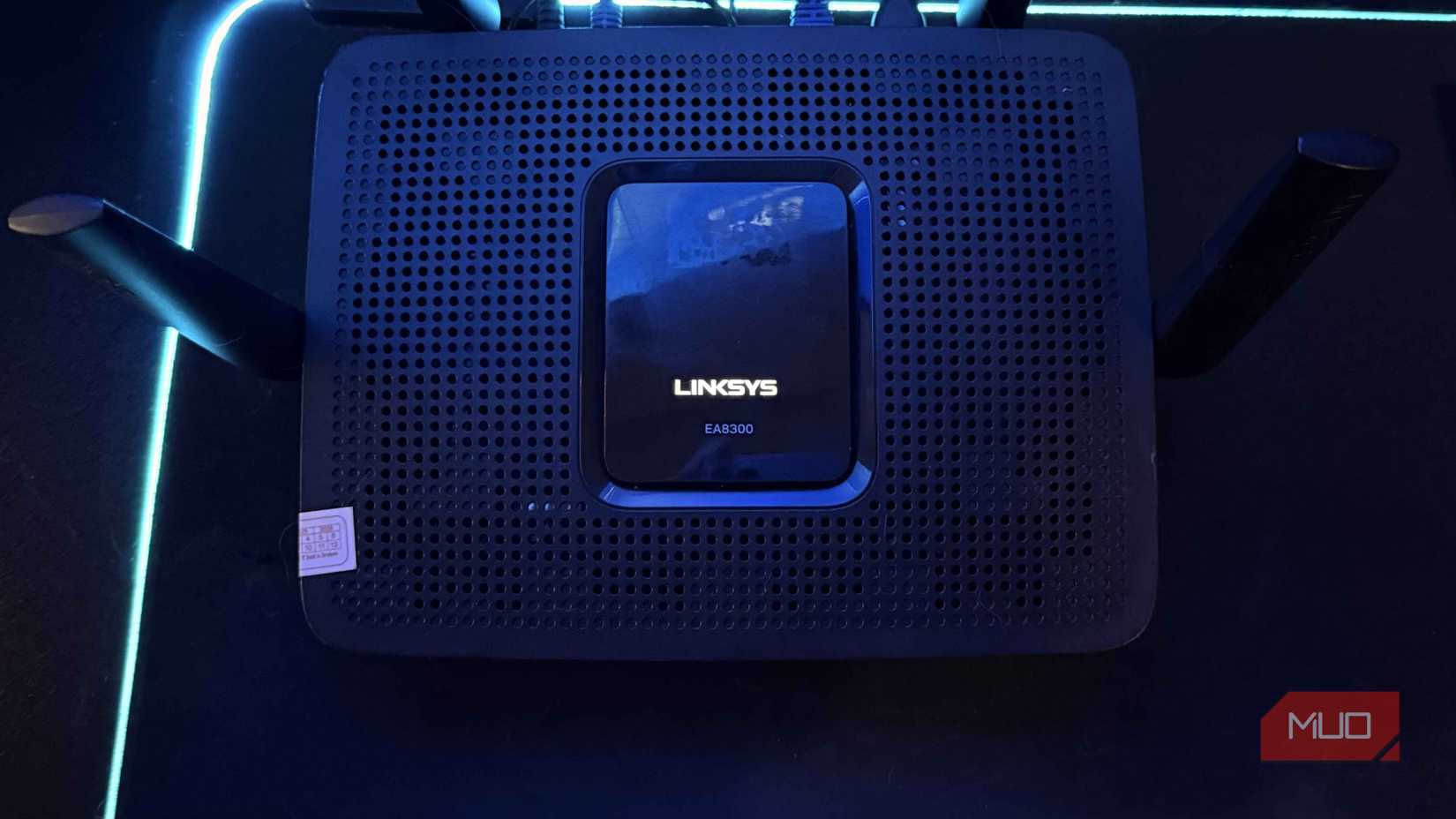 A Linksys EA8300 router on a work desk