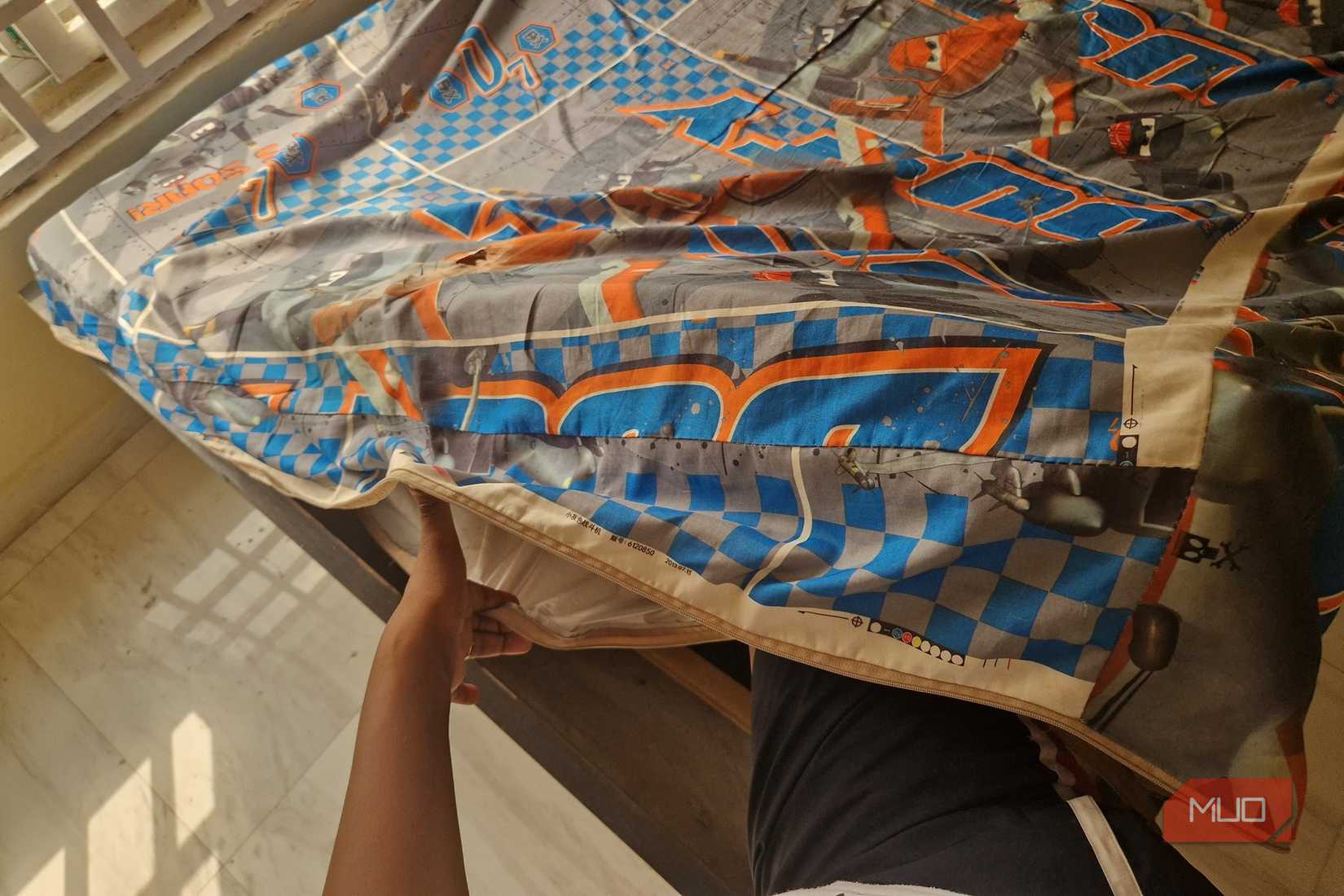 A mattress inside a bedsheet bag.