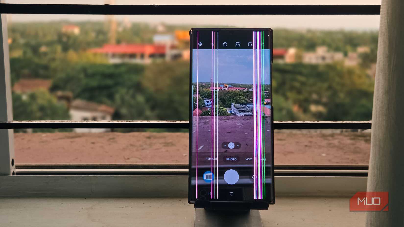 A screen damaged Galaxy Note 20  Ultra with the camera app open 