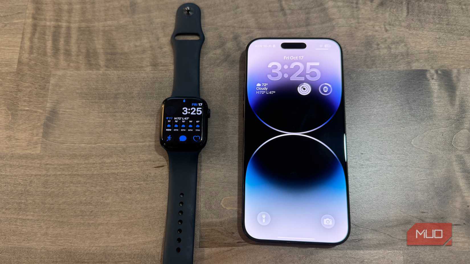 apple watch series 7 and iphone 15 pro max on desk
