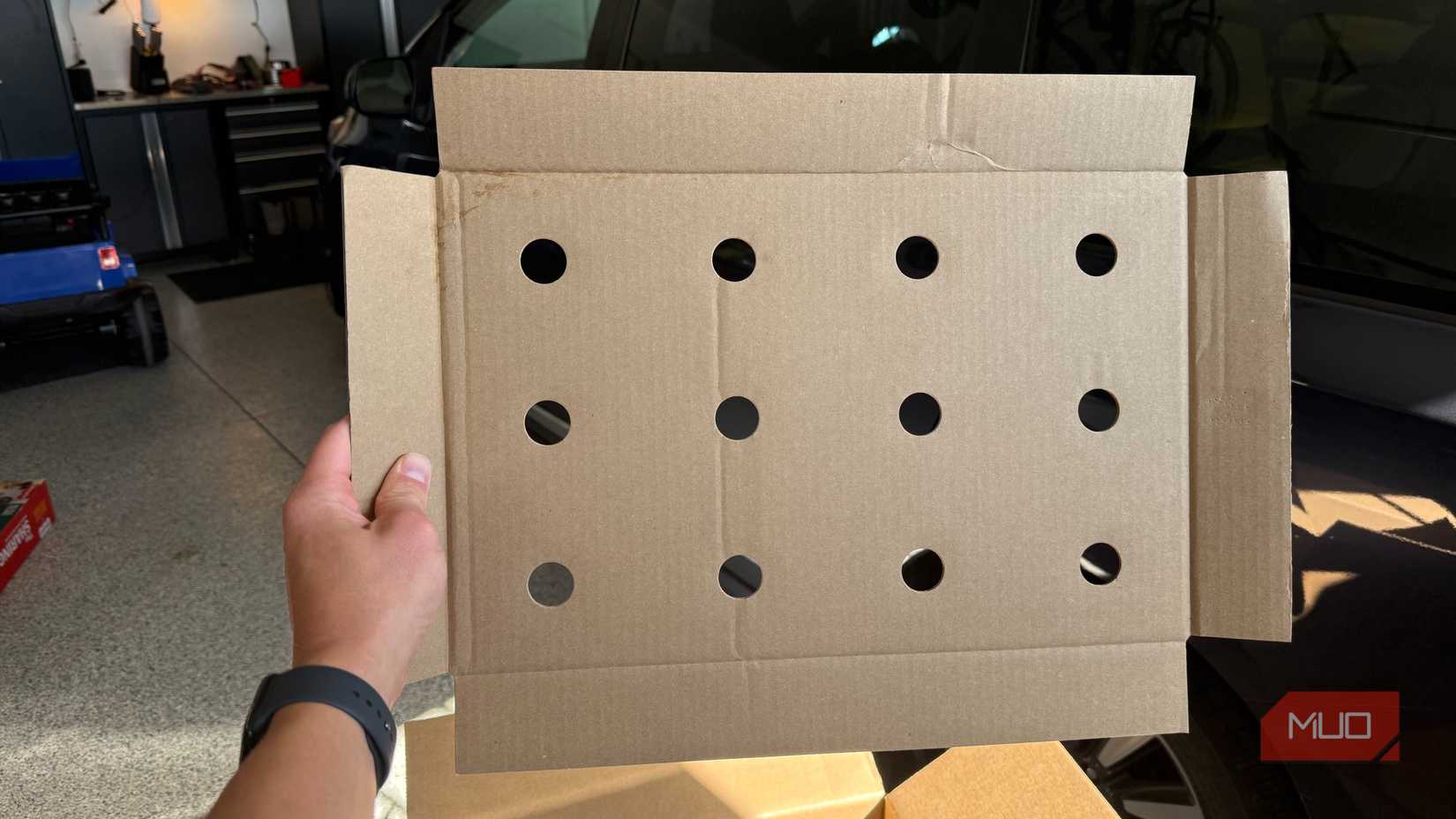 cardboard insert with several holes