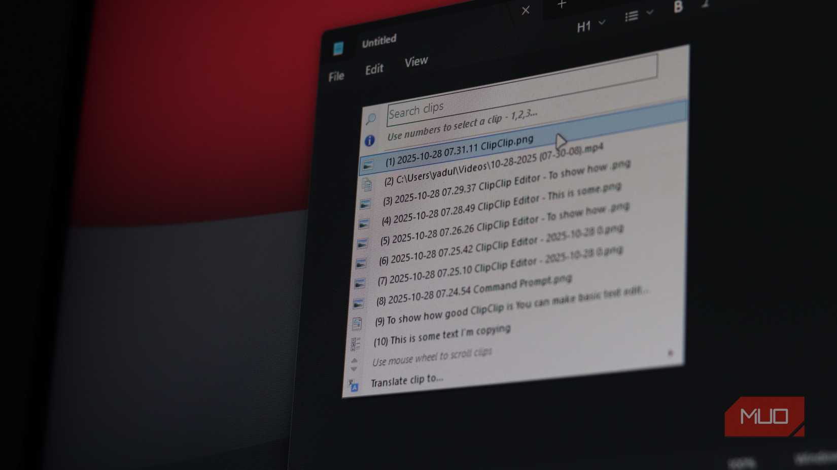 ClipClip paste menu open in Notepad on Windows 11.