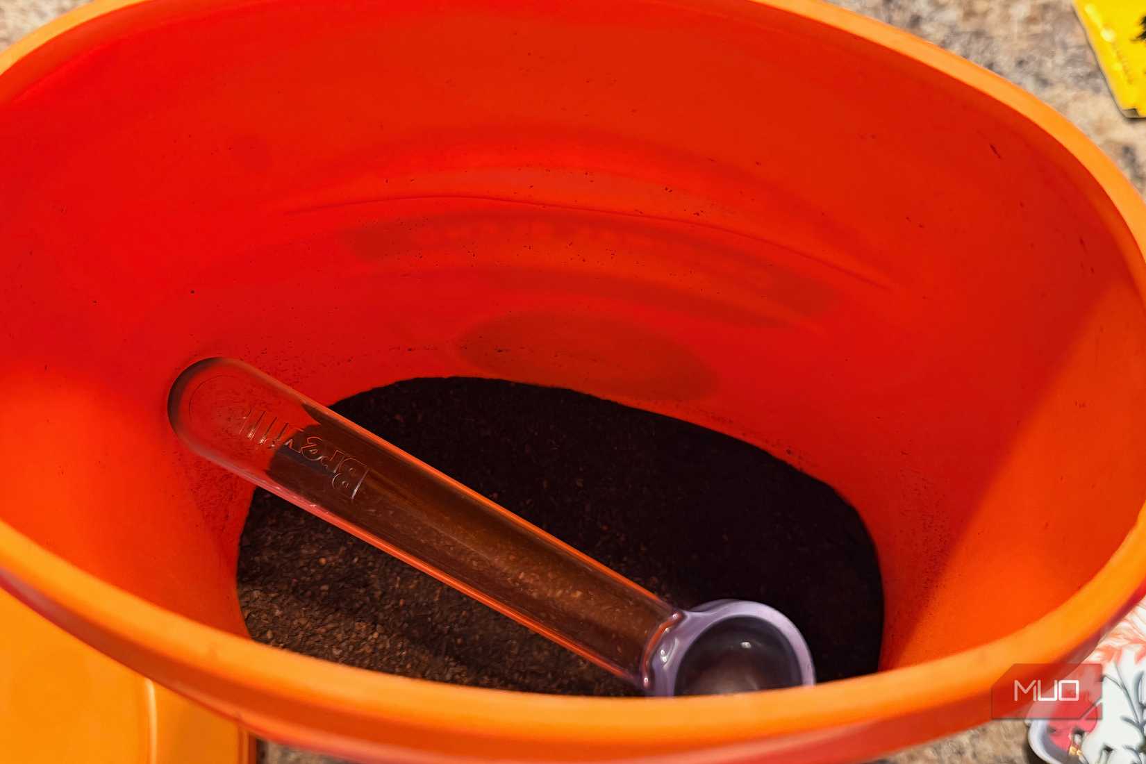 A container of fresh coffee grounds.