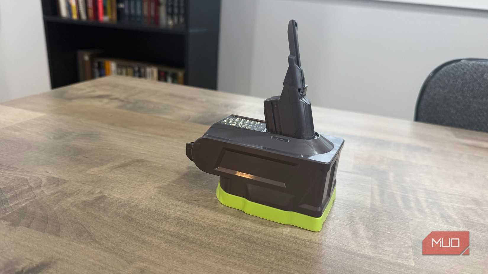Dyson v8 ryobi attachment on desk