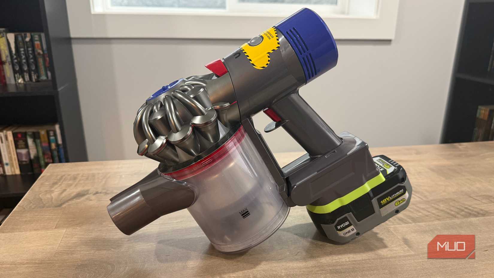 Dyson v8 with ryobi battery unbalanced on desk