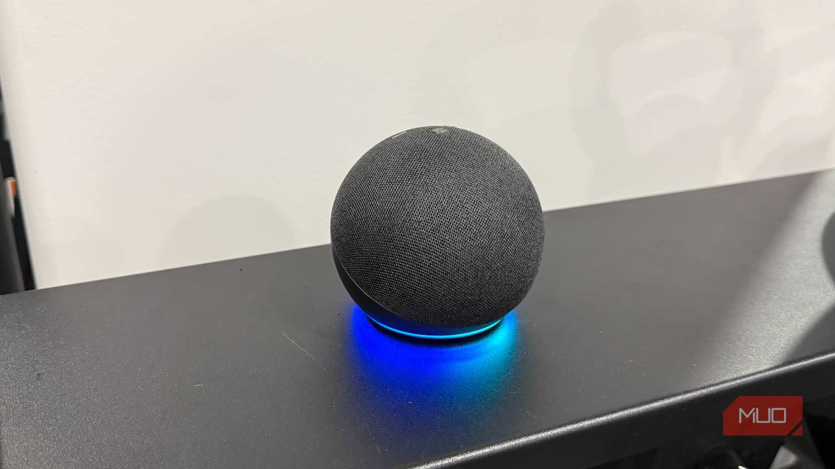 echo dot on black table