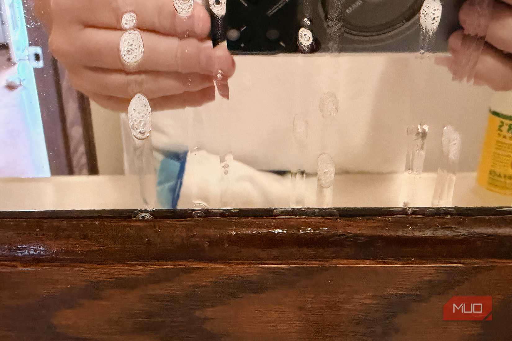 An image showing excessive spray on a bathroom mirror.